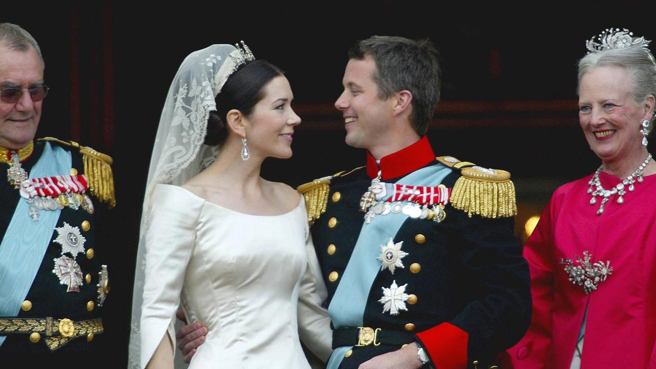 Crown Prince Frederik of Denmark looks lovingly at his new bride, Mary at their wedding in 2004. Picture: AFP PHOTO / POOL / JULIAN ANDREWS