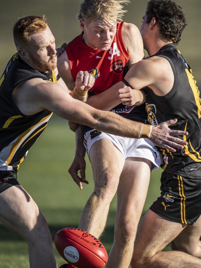 North Hobart’s Thomas Liefhebber is closed down by Tigers William Campbell and Micah Reynolds. Picture: Eddie Safarik