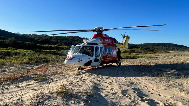 The Westpac Rescue chopper at Queens Head, north of Port Macquarie, after the men were swept overboard and badly injured. They were flown to Newcastle's John Hunter Hospital.