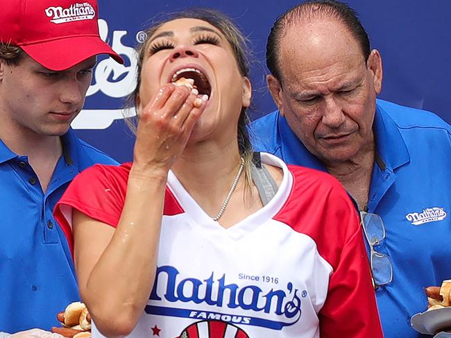 Miki Sudo competes for the women's title during the 2024 Nathan's Famous Fourth of July hot dog eating competition at Coney Island in the Brooklyn borough of New York on July 4, 2024. Sudo won after consuming a record-breaking 51 hotdogs. (Photo by Leonardo Munoz / AFP)