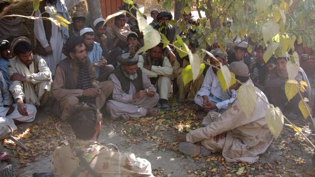 SAS Team Commander Harry Moffitt and an interpreter in a local engagement in Afghanistan. Souce: Supplied