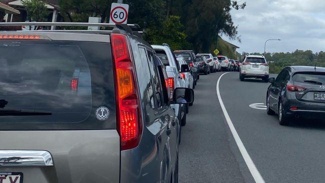 Cars lined up as people wait their turn for COVID-19 tests in Currumbin on Wednesday. Picture: Alexandria Utting.