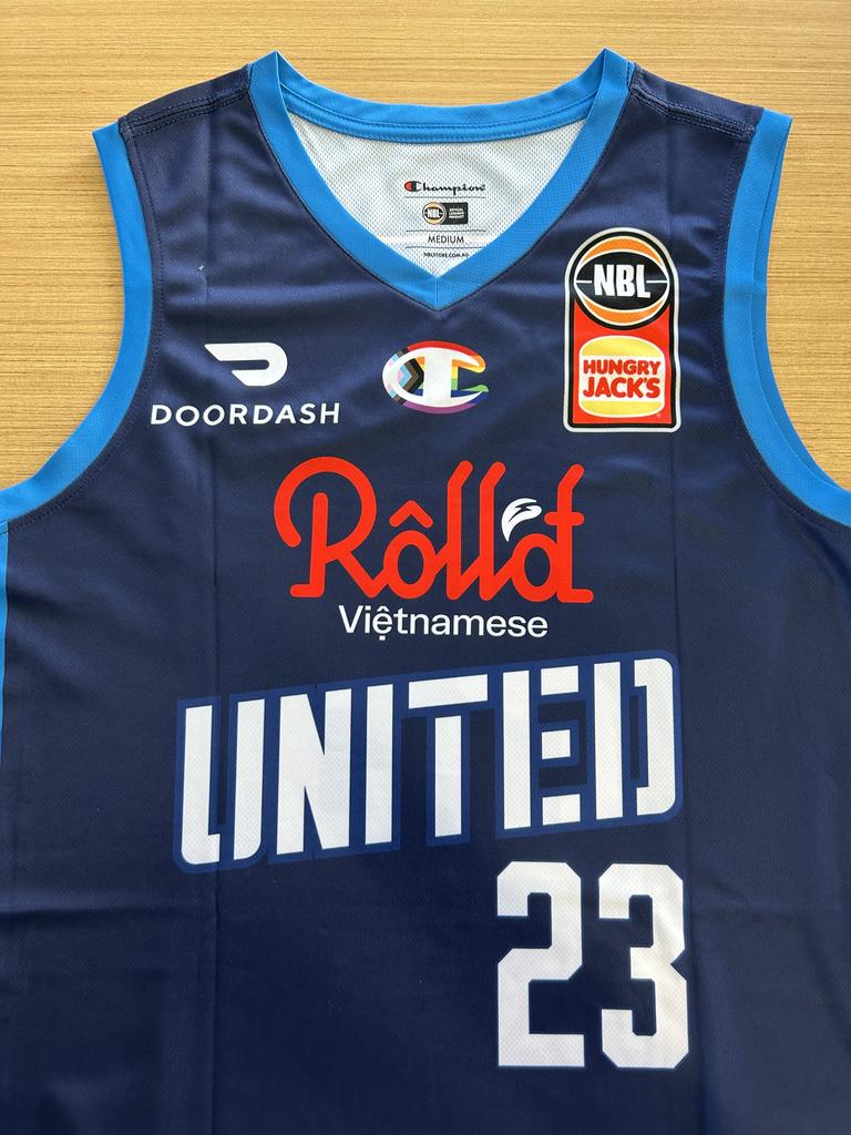 Melbourne United jersey for Pride Round sporting Champion pride logo.