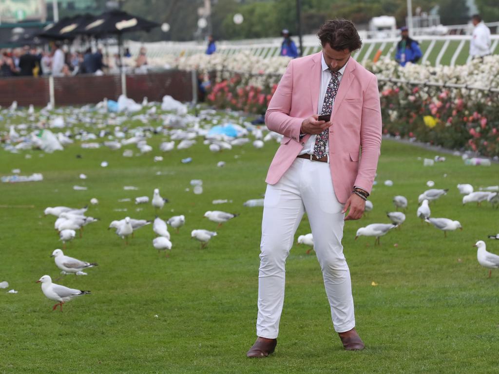 Racegoers are seen at the end of the Lexus Melbourne Cup Day, as part of the Melbourne Cup Carnival, at Flemington Racecourse in Melbourne, Tuesday, November 6, 2018. (AAP Image/Dave Crosling) NO ARCHIVING, EDITORIAL USE ONLY