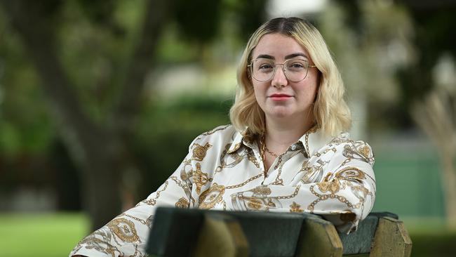 Former Lourdes Hill College student Lillian Jones, 27, at a park near her work in Hawthorne, Brisbane. Lillian was a victim of bullying during her schooling, resulting in years of therapy. Picture: Lyndon Mechielsen