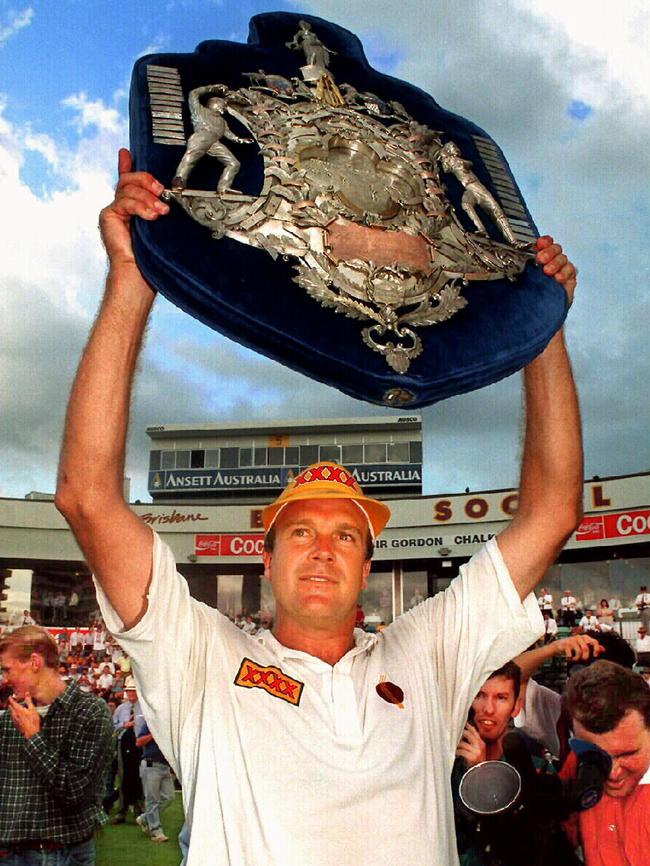 Carl Rackemann holds aloft Qld’s first ever Sheffield Shield.