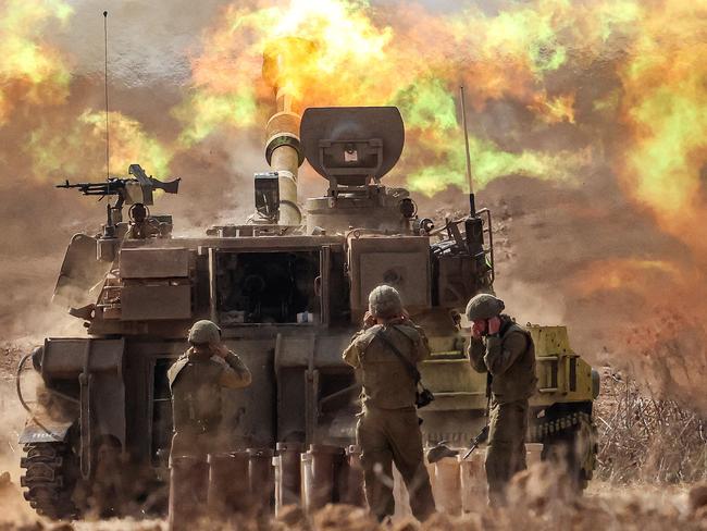 An Israeli army self-propelled howitzer fires rounds near the border with Gaza in southern Israel. Picture: AFP