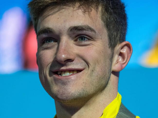 Australia's James Connor poses with his medal after the men's 3m springboard diving final during the 2018 Gold Coast Commonwealth Games at the Optus Aquatic Centre in the Gold Coast on April 11, 2018 / AFP PHOTO / François-Xavier MARIT