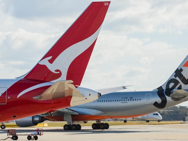 ESCAPE: Jetstar and Qantas aircraf tails. Picture: Jetstar