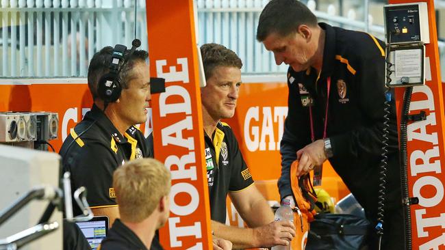 Dejected Damien Hardwick sitting on Richmond’s bench. Picture: Getty