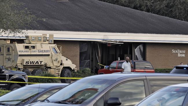 A Highlands County Sheriff's SWAT vehicle is stationed out in front of a SunTrust Bank branch, Wednesday, Jan. 23, 2019. Picture: Chris O'Meara/AP