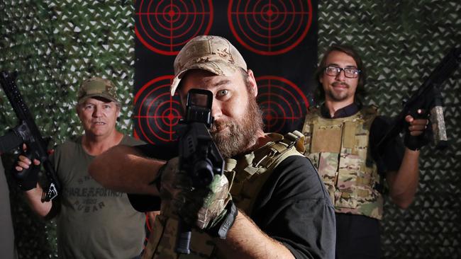 Technician James Butler, Oz Blaster Cairns manager Matt Steer and sales representative Alex Raihman say that the sport is gaining popularity. PICTURE: BRENDAN RADKE