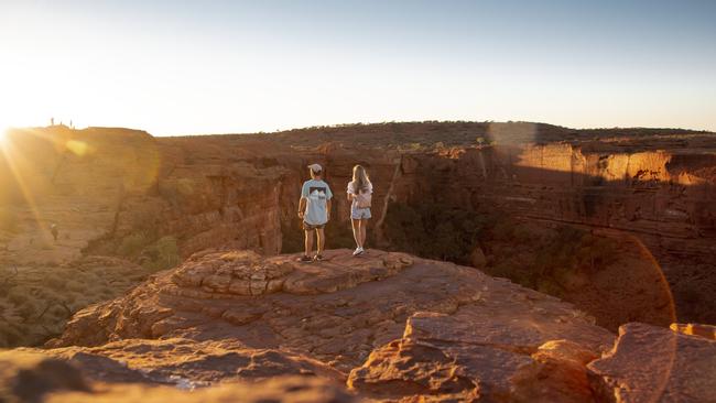 Territorians are spending more time holidaying at home amid the pandemic. Pictured are tourists at the Kings Canyon Rim Walk, Northern Territory. Picture: Tourism Australia