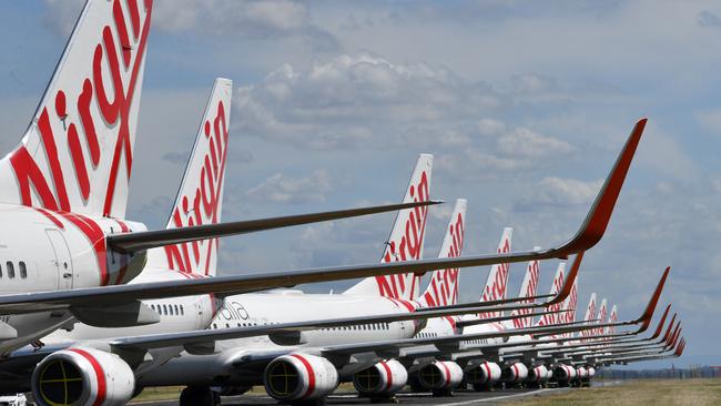 Grounded Virgin Australia aircraft parked at Brisbane Airport. Picture: Darren England/AAP