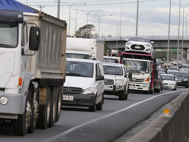 Traffic was brought to an almost standstill as Australian Prime Minister Malcolm Turnbull with Karen Andrews and Bert Van Manen   at exit 31, Loganholme,  announcemented a $215 million upgrade of the M1 to help stop congestion .  . Photo: Jerad Williams