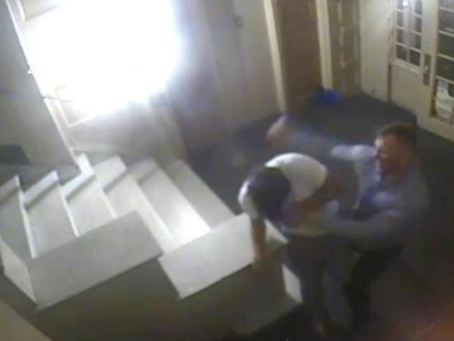 Foyer Area CCTV photo shows former NRL player Matthew Lodge assaulting Joseph Cartright after being let into an apartment building in New York City. Picture: Supplied