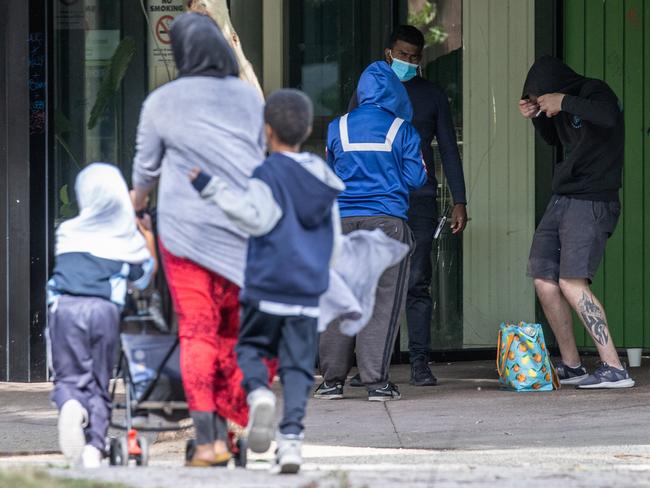 Children walk past intoxicated people.  Richmond supervised injecting room on Lennox street.