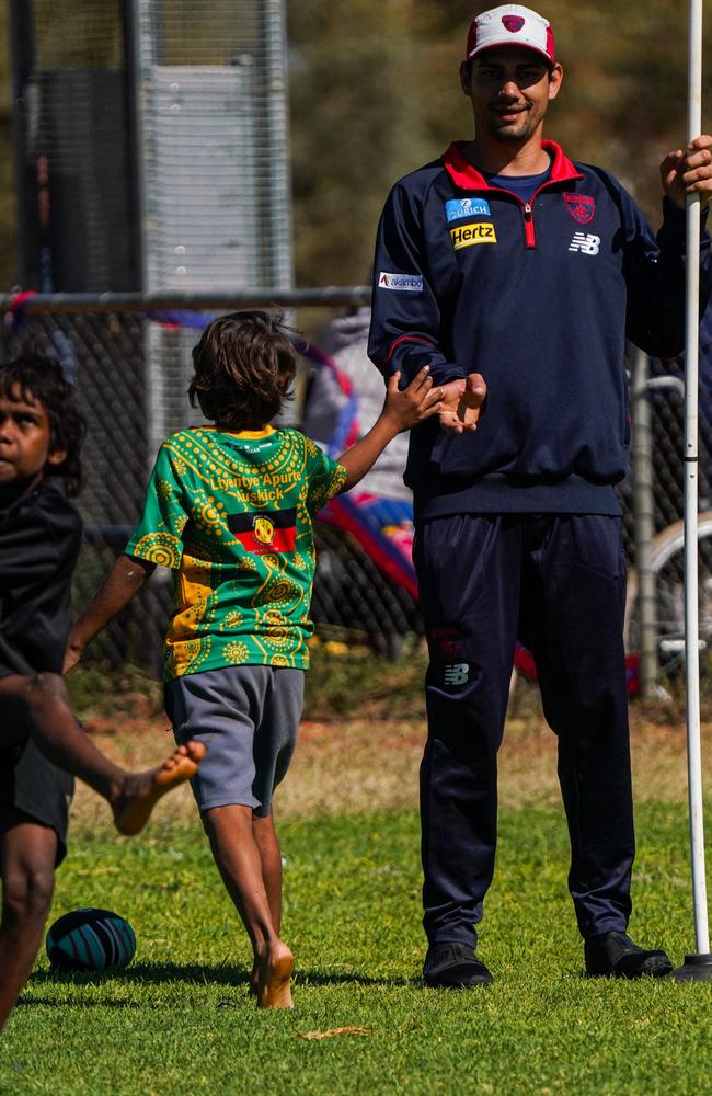 Melbourne Demons players Shane McAdam and Andy Moniz-Wakefield went to Santa Teresa ahead of the 2025 AFL game in Alice Springs. Picture: Melbourne Demons