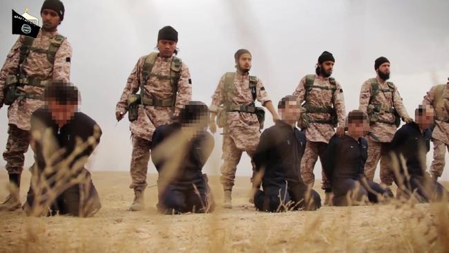 Members of the Islamic State jihadist group preparing the simultaneous beheadings of at least 15 men described as Syrian military personnel. Picture: AFP.