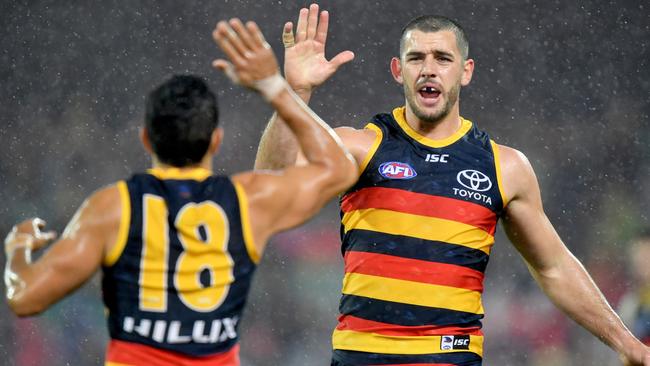 I”M STILL THE MAN: Crows captain Taylor Walker celebrates a goal with teammate Eddie Betts. Picture: Sam Wundke (AAP).