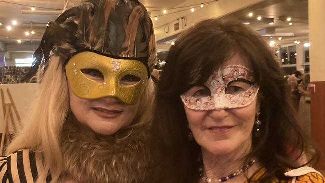 Helene Lynch and Michelle Poncini celebrate at the Gympie RSL Masked Ball, April 29 2023.