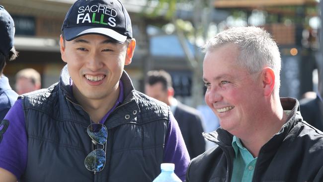 The Stradbroke Handicap barrier draw at Doomben. Owner of Sacred Star Kyan Yap and trainer Tony Pike after they drew barrier 5. Pic Jono Searle.