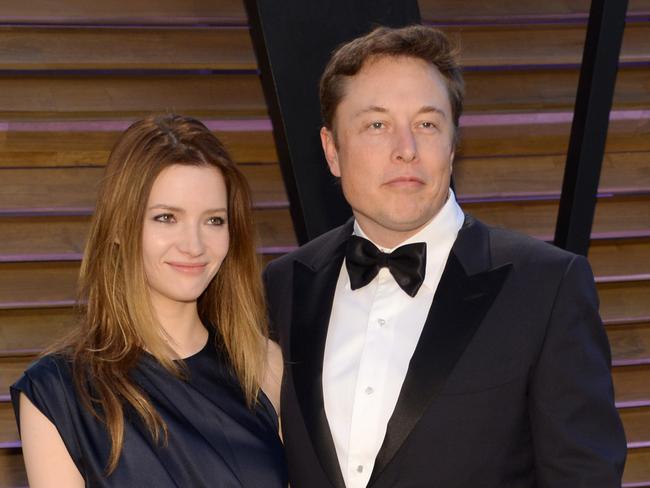 FILE - In this March 2, 2014 file photo, Talulah Riley, left, and Elon Musk attend the 2014 Vanity Fair Oscar Party, in West Hollywood, Calif. Musk and his wife are divorcing for a second time. The entrepreneur and his wife, Riley, issued a joint statement Wednesday, Dec. 31, 2014, announcing they are splitting amicably after they remarried in July 2013 following their previous breakup. (Photo by Evan Agostini/Invision/AP, File)