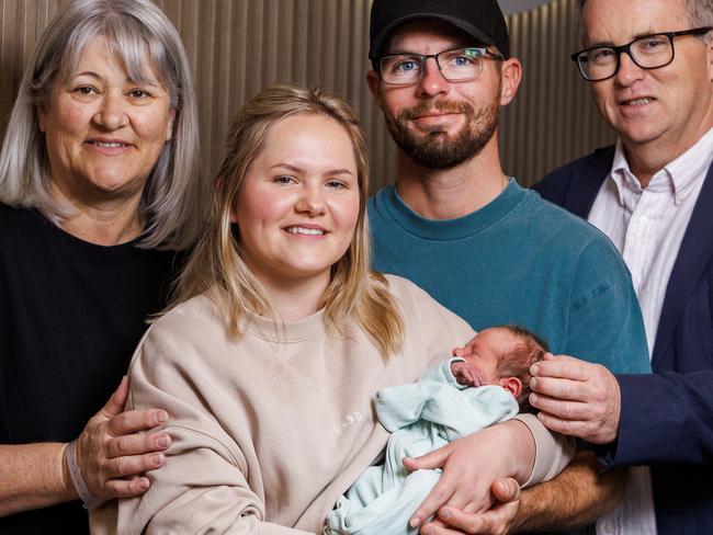 A special arrival: Lisa Sharp with her daughter Cassidy Sharp, grandson Thomas Macartney and his dad Corey with Dr Stephen Cole who cared for the family. Picture: Aaron Francis