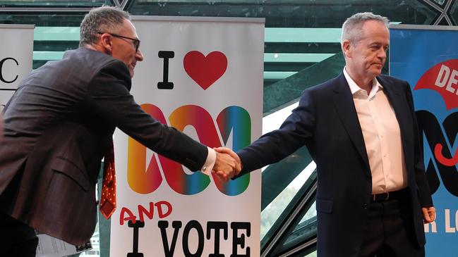 Greens leader Richard Di Natale shakes hands with Opposition Leader Bill Shorten at the ABC Friends’ leaders forum in Melbourne on Saturday. Picture: AAP/Lukas Coch