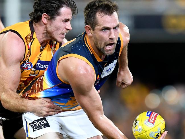 BRISBANE, AUSTRALIA - JUNE 01: Luke Hodge of the Lions gets a handball away during the round 11 AFL match between the Brisbane Lions and the Hawthorn Hawks at The Gabba on June 01, 2019 in Brisbane, Australia. (Photo by Bradley Kanaris/AFL Photos/Getty Images)