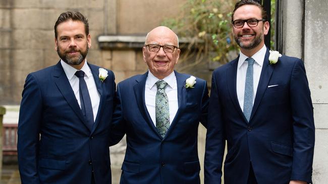 Australian born media magnate Rupert Murdoch (C) flanked by his sons Lachlan (L) and James (R) March 5, 2016 (Photo by Leon NEAL / AFP)