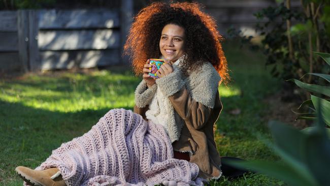 Mckenna Lea rugged up with a hot coffee. Picture: Glenn Hampson