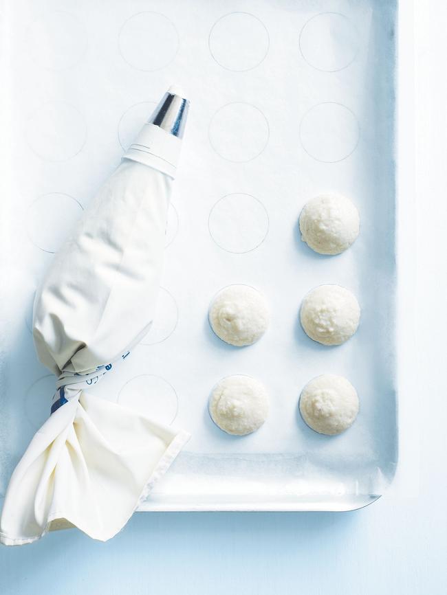 Pipe 4cm circles onto a baking tray and allow the macarons to rest for about 10 minutes before baking.