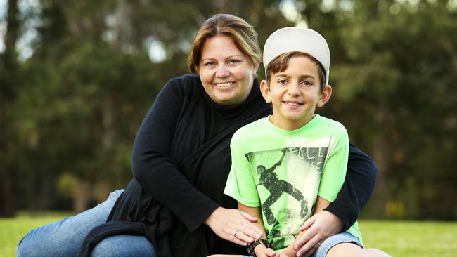 Amanda Smith with her son Samuel, 12, from Wetherill Park today. Amanda has benefited from the No Interest Loan Scheme three times in the past eight years. It's allowed her to buy a washing machine, an air-con and pay for a green slip. But more importantly it inspired her to become a community worker. Her positive experience of NILS was part of the reason why she completed Tafe then uni study in the field. She now works for the Smith family providing a fantastic scheme called Saver Plus, which teaches financial literacy and provides funding for education. (Pictures Justin Lloyd)