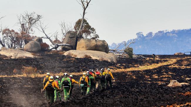 The ‘hotshot crew’ carry chainsaws, mattocks and blowers. Picture: Aaron Francis