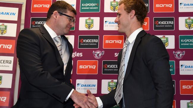 Manly-Warringah Sea Eagles NRL player Daly Cherry-Evans (right) shaking hands with club CEO Joe Kelly after he revealed he was turning his back on the Gold Coast Titans, signing a “lifetime deal” the Manly Sea Eagles. (AAP Image/Paul Miller)