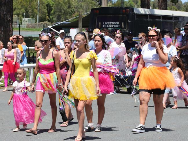 Mourners wear brightly coloured and fairy costumes. Picture: Glenn Hampson