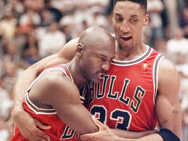 11Jun97. The Chicago Bulls' Michael Jordan collapses in the arms of teammate Scottie Pippen, right, at the end of Game 5 of the NBA Finals with the Utah Jazz, in Salt Lake City. Jordan, fighting flu symptoms, scored 38 points as the Bulls beat the Jazz 90-88 to take a 3-2 lead in the series.  (AP Photo/Tom Cruze) /basketball