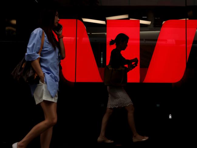 SYDNEY, AUSTRALIA - MARCH 27: Pedestrians walk past Westpac Banking Corp. logo at Westpac Place building on March 27, 2024 in Sydney, Australia. In the last quarter, Westpac Bank reported a quarterly cash profit of A$1.8 billion, meeting consensus expectations, while NAB experienced a 17% decline in first-quarter cash profit compared to the previous corresponding period, reflecting varying performances among the major Australian banks. (Photo by Brendon Thorne/Getty Images) (Photo by Brendon Thorne/Getty Images)