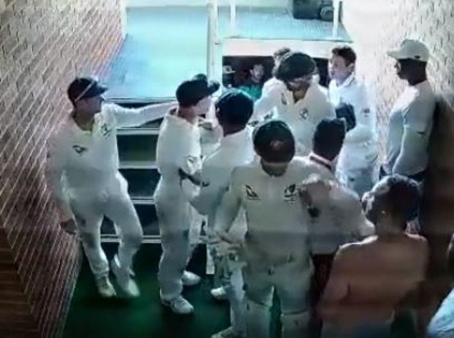 DAVID Warner had to be restrained by teammates.