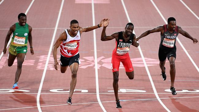 Zharnel Hughes of England crosses the ahead of Jereem Richards of Trinidad and Tobago in the men’s 200m. Photo: Getty Images