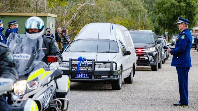 The hearse carrying Constable Glen Humphris’s body at Hovell Tree Park in Albury. Picture: AAP Image/Simon Dallinger