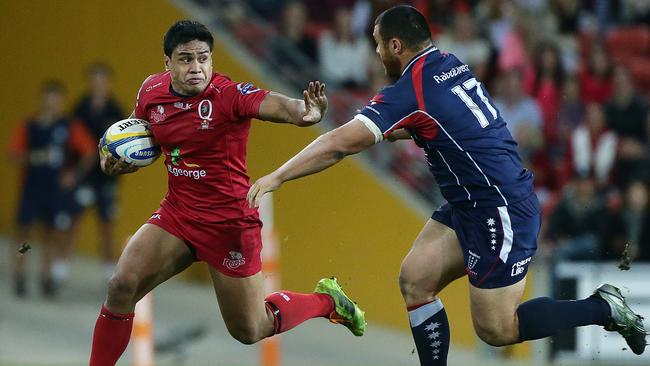 Reds Ben Tapuai fends off Rebels Max Lahiff. The Queensland Reds vs the Melbourne Rebels at Suncorp Stadium in Brisbane. Pic Peter Wallis