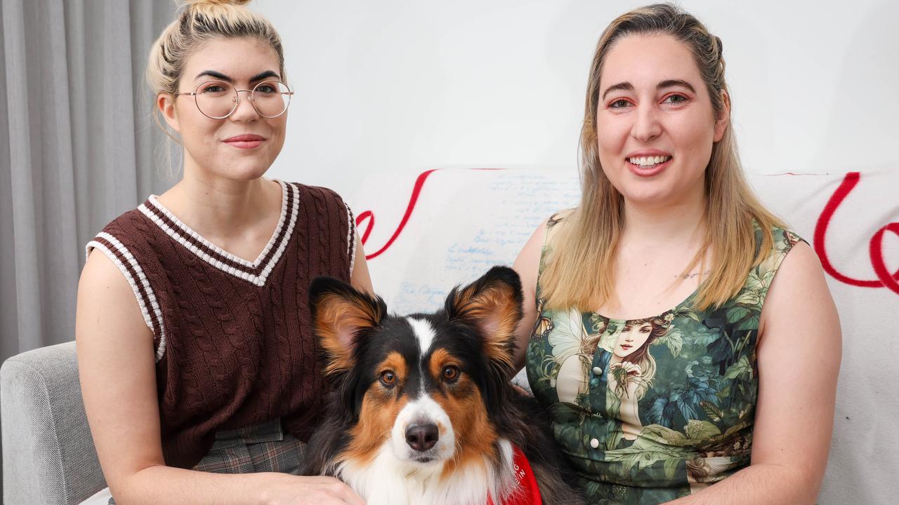 Sarah and Britney with their dog Poet.