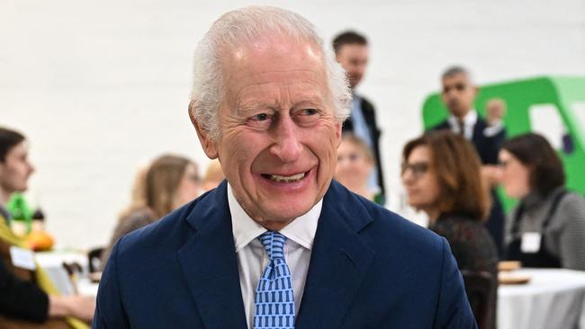 Britain's King Charles III (L) speaks with pupils of the primary school Rye Oak benefiting from the Coronation Food Project, as he visits to the Coronation Food Project hub, located at the Deptford Trading Estate, in southeastern London, on November 14, 2024, during the centre inauguration. To celebrate his 76th birthday and the first anniversary of the Coronation Food Project, the King opened the initiativeâs first two Coronation Food Hubs â one in person and one virtually. The hubs are major distribution centres, designed to save and circulate surplus food and to support communities in need. (Photo by JUSTIN TALLIS / POOL / AFP)