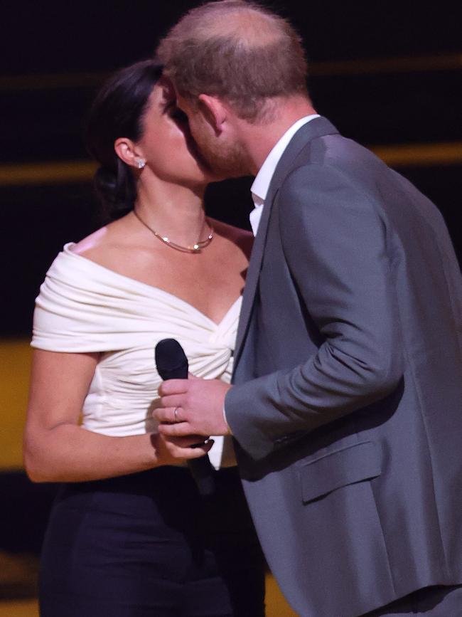 The pair shared a kiss in front of a packed crowd. Picture: Chris Jackson/Getty Images for the Invictus Games Foundation