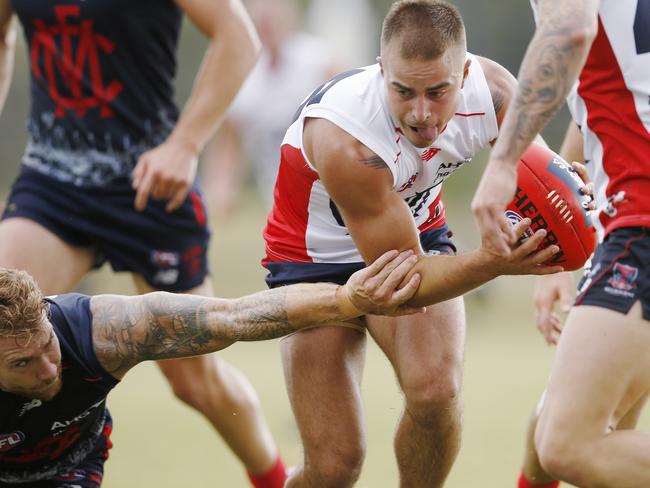 Ben Kennedy tries to break clear at Melbourne training. Picture: Michael Klein