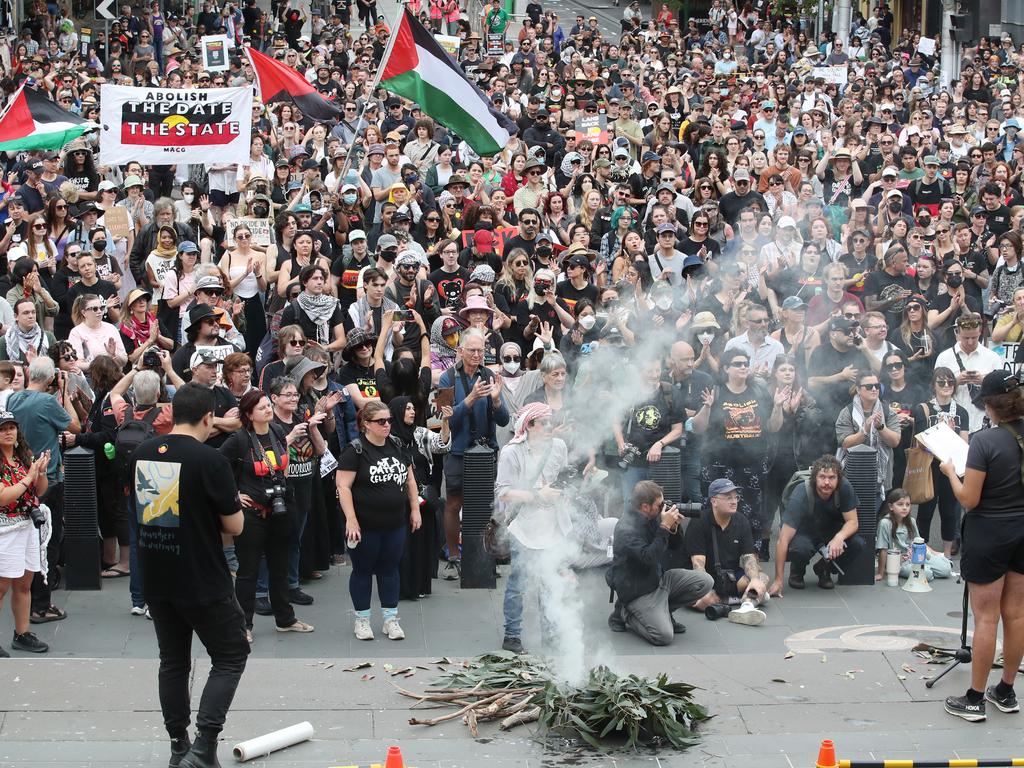 A smoking ceremony at the Invasion Day Rally. Picture: David Crosling