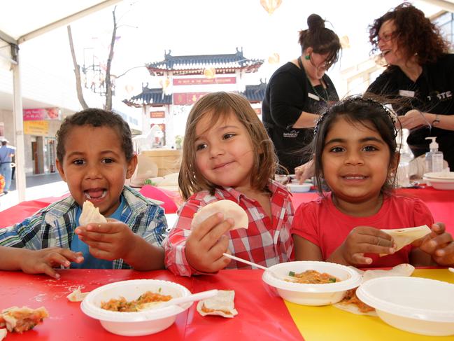 Tyrell Day, 4, Marco Mazzaferro, 3 and Sophie Singh, 4, making dumplings for Moon Festival in Cabramatta.