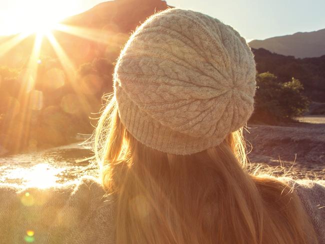 ESCAPE: Queenstown St Moritz feature focusing on female guests by Andrea Black, July 1. iStockYoung woman by the lakeshore arms outstretched for freedom and positive emotions. Spectacular landscape on the background.